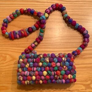 Rising Tide colorful wool ball bag.
